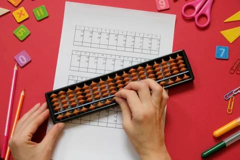 Mental arithmetic and math concept: colorful pens and pencils, numbers, abacus Stock Photos