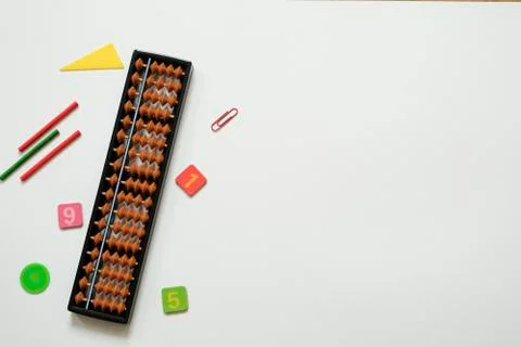 Mental arithmetic and math concept: colorful pens and pencils, numbers, abacus Stock Photos