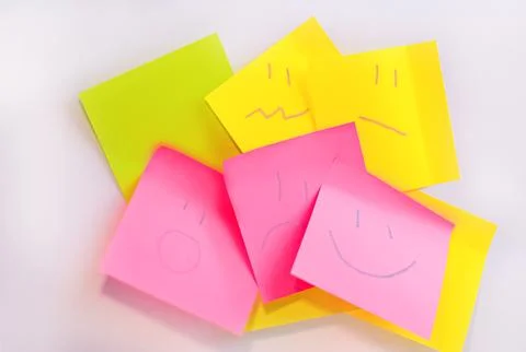 Mental disorder concept. Multi-colored stickers - smilies. Lots of emotions Stock Photos