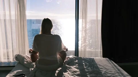 Mental health. Rear view of a meditating young woman against the backdrop of the 스톡 동영상 167562753