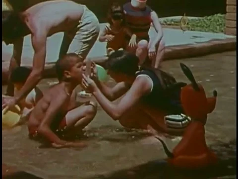 Mentally challenged children learn developmental concepts in a wading pool in Video stock 74935182