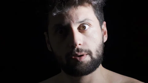 Mentally ill man on black background, mental disorders and hallucinations. Stock-Footage 222493517