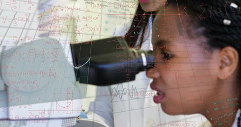Mentor aligning microscope camera and guiding student adjusting focus in lab Stock Footage 316186069