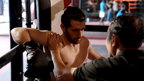 Mentor coaching him on how to fight deliberately in order to defeat Stock Footage 240071155