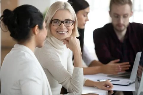Mentor explaining project task to intern student Stock Photos