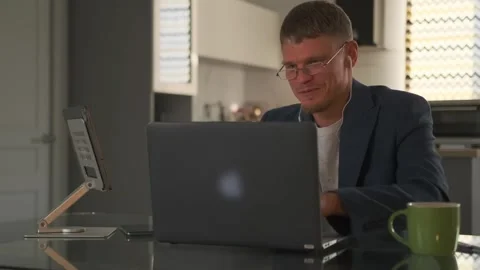 Mentor identifies code errors via video call, creating a friendly vibe. Stock Footage 294299537