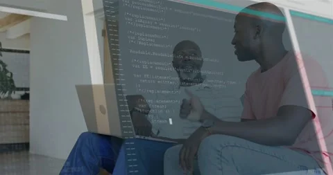 Mentor nodding, mentee pointing at laptop, showing code overlay and confirming Stock Footage 320955298