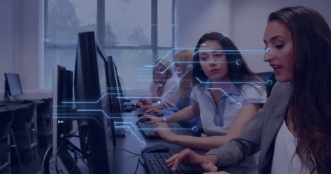 Mentor pointing at code on monitor while trainee typing in tech lab as data-flow Stock Footage 313704001