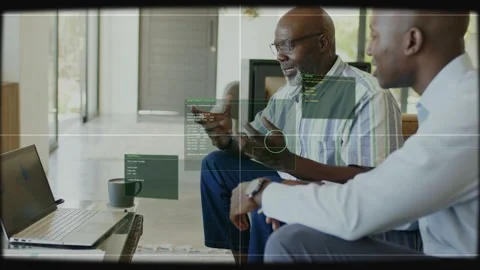 Mentor tapping phone and guiding laptop data for tech demo, animated AR boxes Stock Footage 333368723