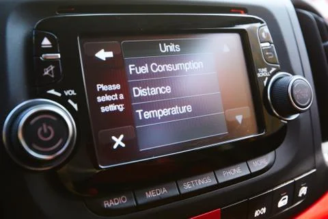 Menu and Select button on multimedia control panel of head unit in luxury car Photos