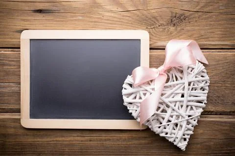 Menu blackboard and wooden background. Stock Photos