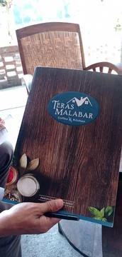 A menu book at a cafe called "Teras Malabar" in the Pangalengan Stock Photos