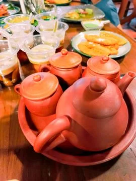 A menu for breaking the fast with some sweets and several cups of hot tea Stock Photos