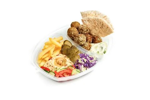 Menu combo - hummus with vegetable salad, French fries, pita and falafel in a Stock Photos