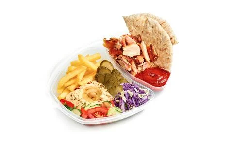 Menu combo - hummus with vegetable salad, French fries, pita and chicken shaw Stock Photos