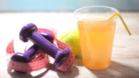 Menu diet plan or program, a glass of cocktail berries, tape measure, dumbbel Stock Footage 100263619