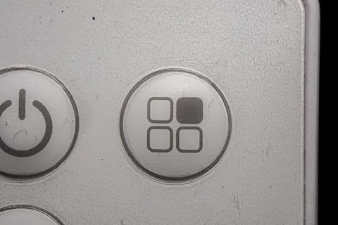 Menu icon and button close up of an air conditioner remote controller Stock Photos