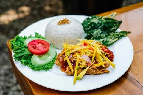 The menu of a restaurant called Mango Chicken. Flour fried chicken with spi.. Stock Photos