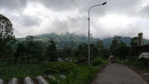Merapi Volcano Countryside in Soft Afternoon Light - POV Riding Motorbike Stock Footage 325101068