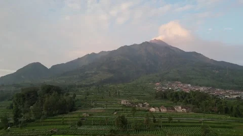 Merapi Volcano mountainside in the morning with vegetable garden Vídeos de archivo 247360533