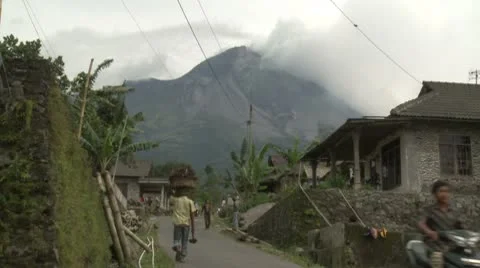 Merapi Volcano Towers Over Rural Village Stock Footage 8838239
