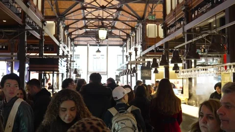 Mercado de San Miguel crowded interior with food stalls and people Madrid Spain Stock Footage 334454247