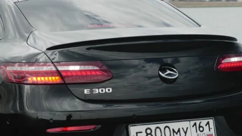 Mercedes-Benz E 300, close-up of the logo on the trunk. Reverse gear engaged, re Video stock 201897664
