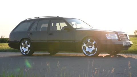 Mercedes-Benz E-Class E220 Wagon S124 parked on the road. Stock Footage 295770821
