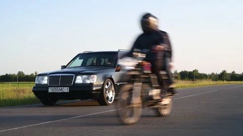 Mercedes-Benz E-Class E220 Wagon S124 parked on the road. Stock Footage 295770835