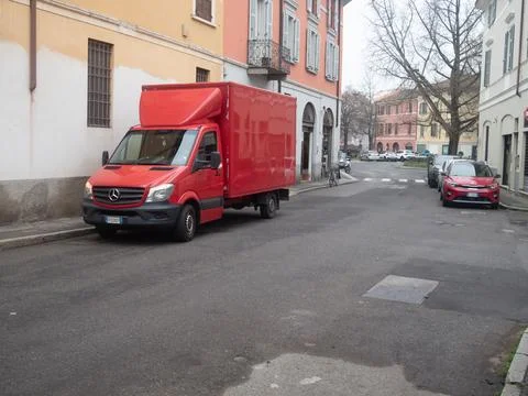 Mercedes Benz Sprinter box van parked on a narrow Italian street in a resid.. Stock Photos