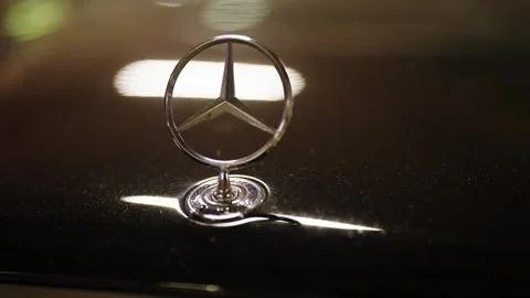 Mercedes-Benz star logo on a luxury car bonnet Stock Footage 343549341