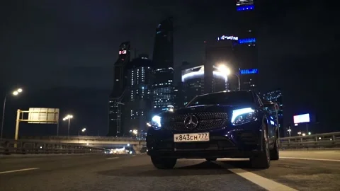 Mercedes on an empty road against the backdrop of city lights. Stock Footage 150106702