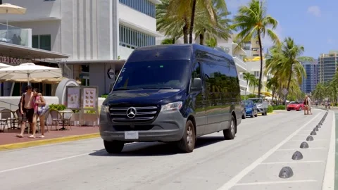 Mercedes sprinter limo van arriving at a hotel on Ocean Drive Miami Beach Stock Footage 342083089