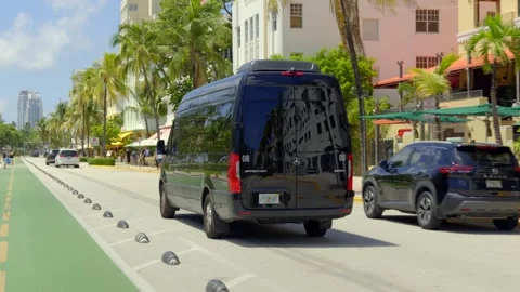 Mercedes Sprinter Van on Ocean Drive tracking video Stock Footage 342083096