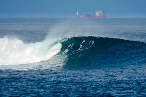 Merchant ship among the waves Stock Photos