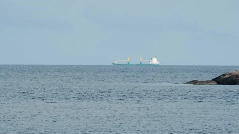 Merchant Ship at the Horizon Stock Footage 131378514