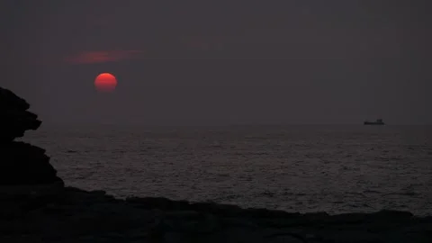 Merchant ship sails on the ocean at sunset. Slow motion 4K Video stock 292969749