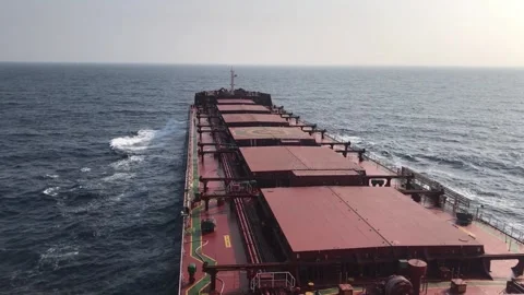 A merchant ship underway at sea, view of deck from bridge Stock Footage 276695595