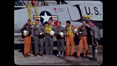 Mercury Program original seven astronauts pose for photo infront of Convair F102 Stock Footage 263292301