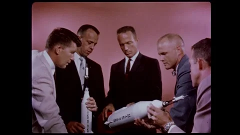 Mercury Program original seven astronauts discussing model of spacecraft Stock Footage 263292321