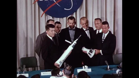 Mercury Program original seven astronauts pose for photo with spacecraft models Stock Footage 263292361