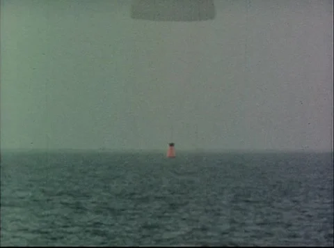 Mercury Project capsule descending with main parachute deployed 스톡 동영상 297464887