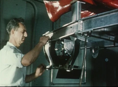 Mercury Project engineer working on astronaut dynamics simulator Stock Footage 297465159