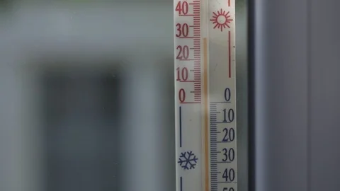 Mercury thermometer attached to the window outside the room shows a temperature Stock Footage 111712939