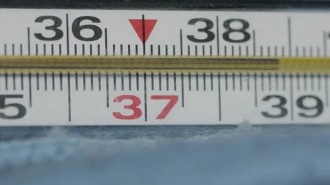 Mercury thermometer close-up rotating. high body temperature Video stock 137844359