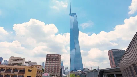 Merdeka 118 with reflective glass facade under partly cloudy sky. Stock-Footage 314788134