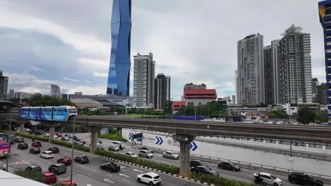 Merdeka 118 skyscraper and the KL Monorail in Kuala Lumpur, Malaysia rush hour Stock Footage 327521135