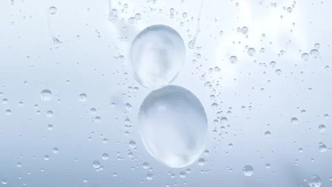 Merging top-right beads forming runner while two large drops sliding on glass by Stock Footage 348240302