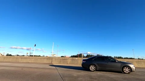 Merging in to traffic from an on ramp onto interstate 20 in Augusta Georgia Stock Footage 148060549