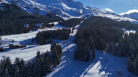 Meribel Alpine Chalets Pine Forest Ski Lift Winter Aerial Drone Video 4K 動画素材 335921999